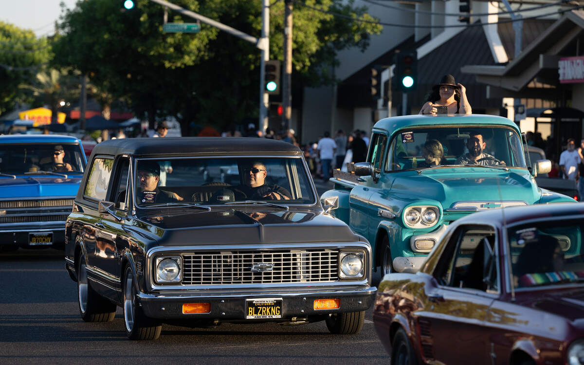 Classic car owners drive down McHenry Avenue during the American Graffiti Parade in Modesto Friday, June 12, 2026.